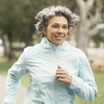 Older woman out for a jog in cold weather
