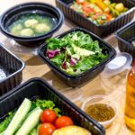 Healthy meal delivery kit with lots of different types of foods.